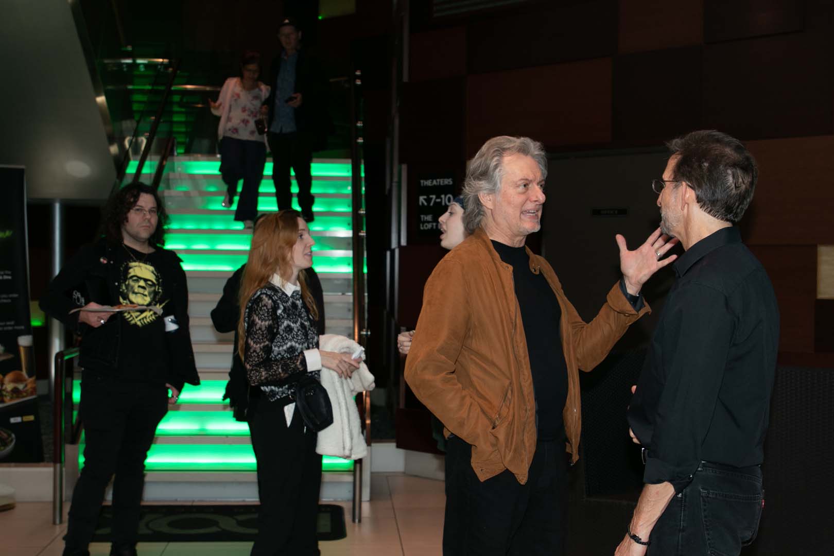 Audience members speaking with Tony Gardner on their way out of the theater.