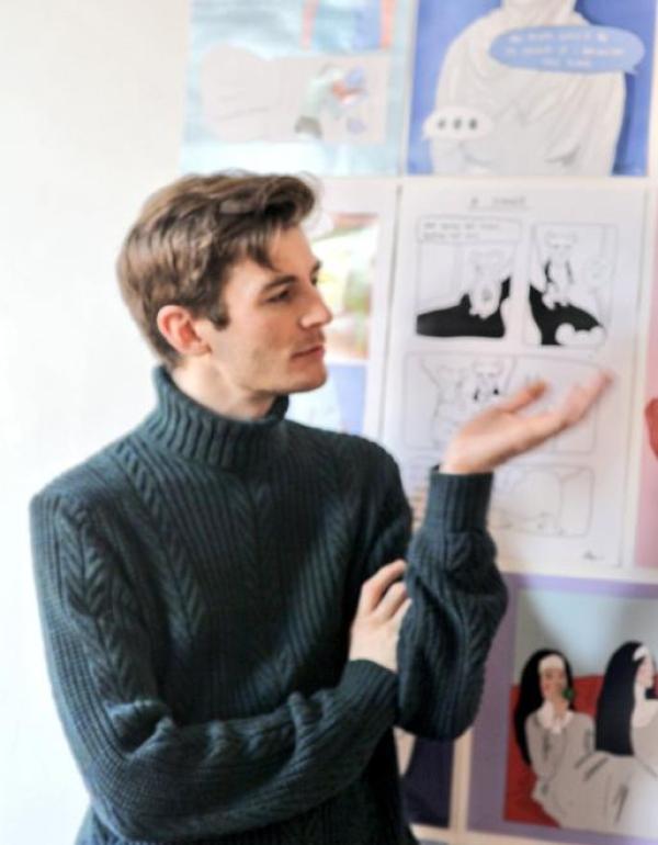 Kris J. Cummins wearing a polo neck, trying to look like Roger Moore