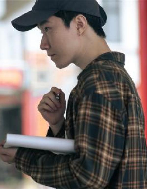 Director Andrew Teng working on set