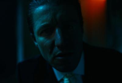 A mysterious man looks you directly in the eyes. 