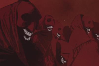 Creepy robed ghouls with white smiling teeth enjoy the show