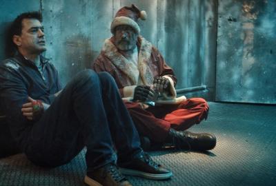 Mr. Serverson (Ron Livingston) freezing with Santa