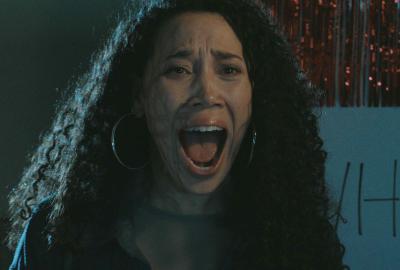 A woman screaming in terror