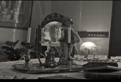 A little girls reflections shows in a mirror