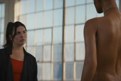 Liana looks at a mannequin