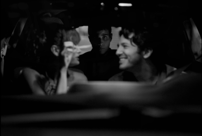 Cole stares into the camera form the backseat, while Charlie and Anika have fun up front.