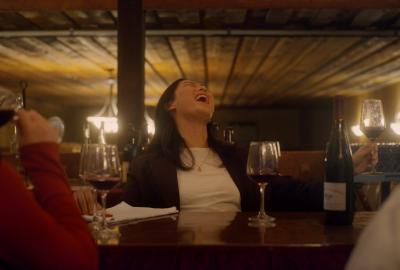 Friends laughing at a wine tasting