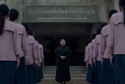 The strict principal stands before her students