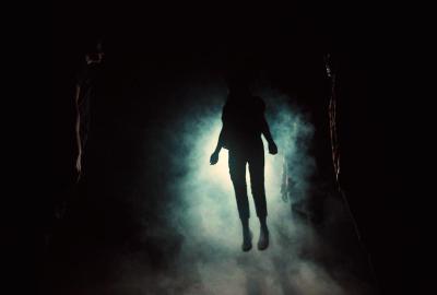 A woman floats in the fog