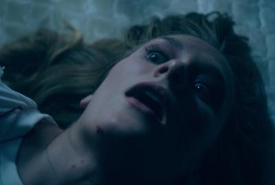 Amber lays on the bed staring up