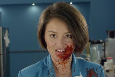 In the Kitchen With . . . film still bloody faced woman