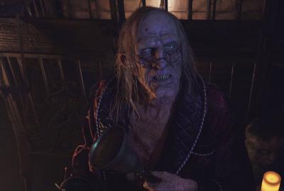 Scary old man looks on