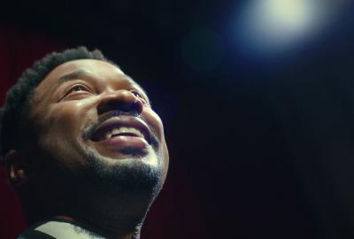 A basks in a standing ovation.