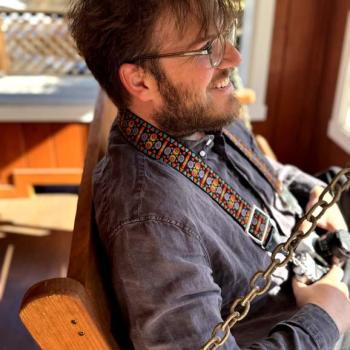 Nathan Hertz sits and smiles.