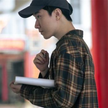 Director Andrew Teng working on set